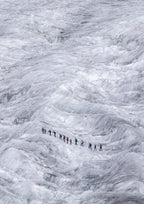 A group of mountaineers trails across the Aletsch Glacier in Switzerland