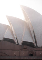 The Sydney Opera House in early morning winter light, wrapped by haze