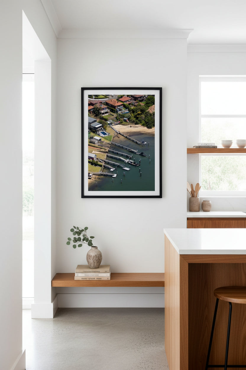 Aerial view of a waterfront properties with docks and boats on Sydney Harbour.