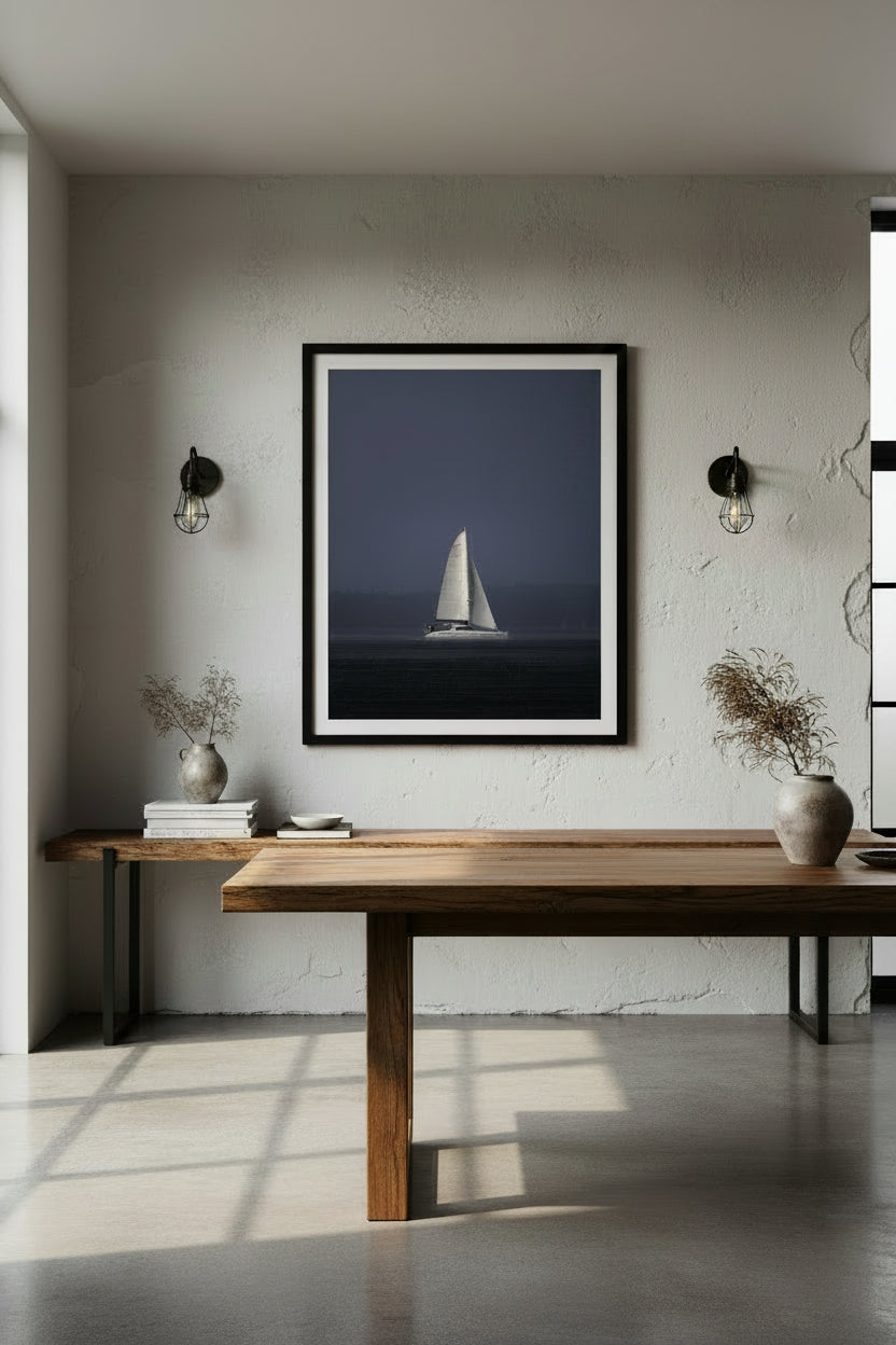 Sailboat on Sydney Harbour with in a rainy dark sky.