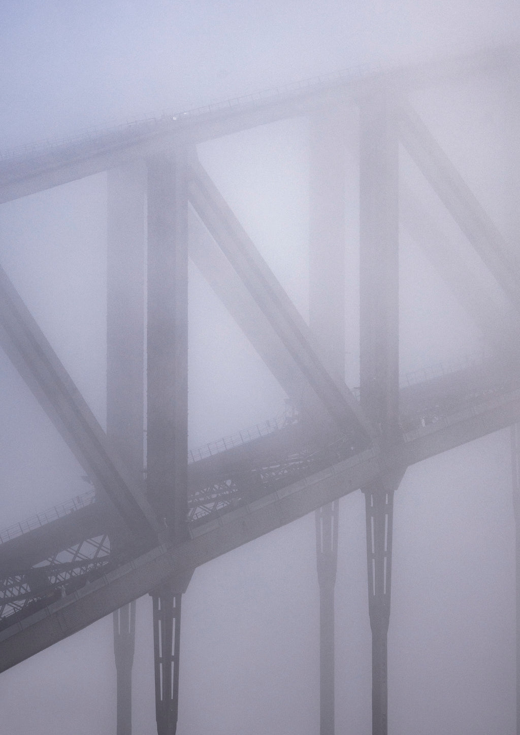 Arches of the Sydney Harbour Bridge in winter fog