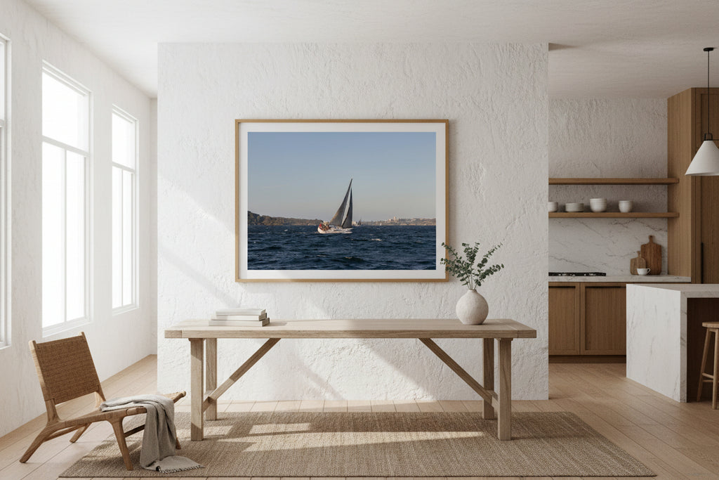 Sailboat on Sydney Harbour with the Manly skyline in the background.