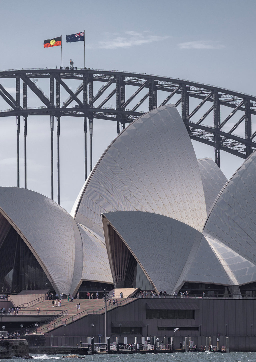 The Sydney Opera House and Harbour Bridge standing side by side on a bright summer's day