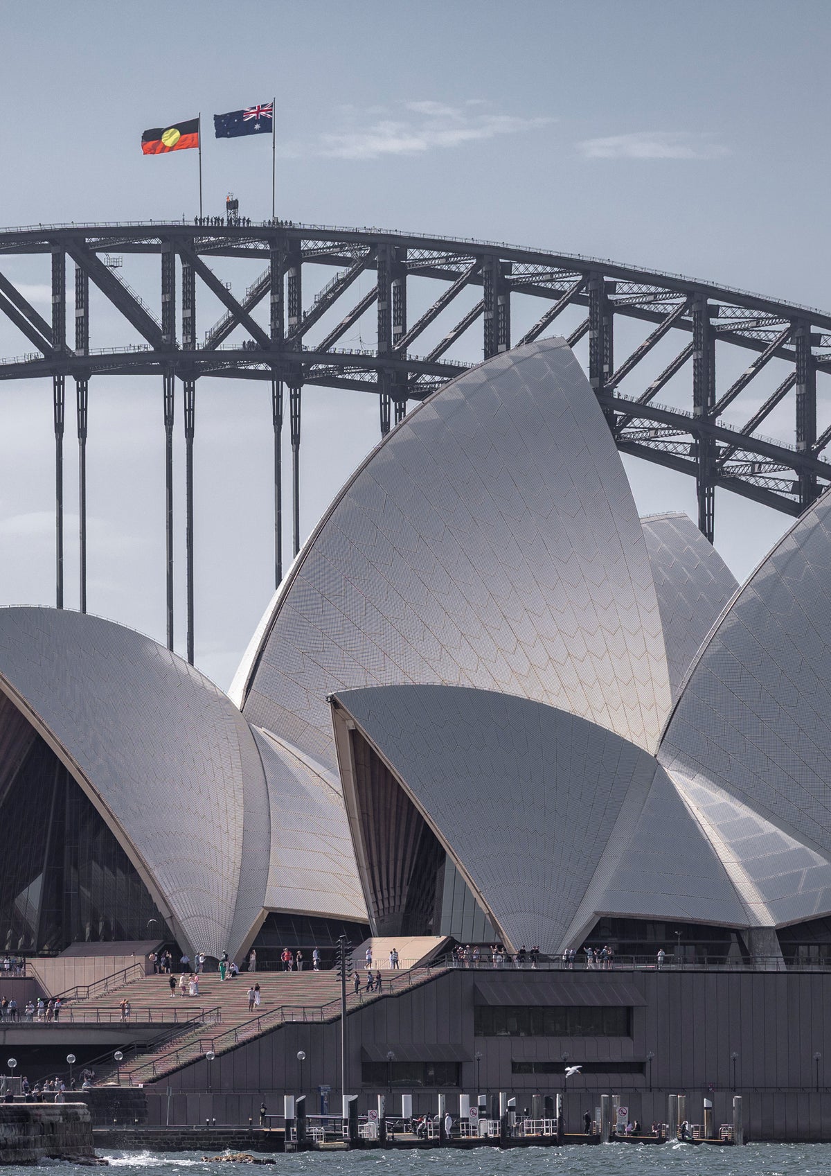 The Sydney Opera House and Harbour Bridge standing side by side on a bright summer's day