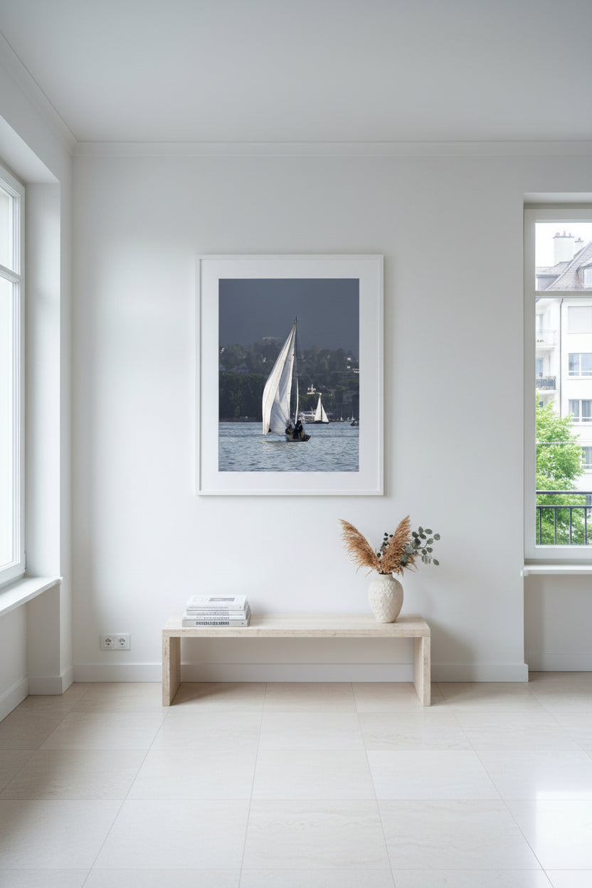 Sailboats on a body of water with a cityscape in the background